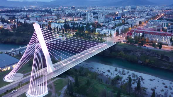 Podgorica Montenegro at night, featuring illuminated cable-stayed Millennium bridge alt
