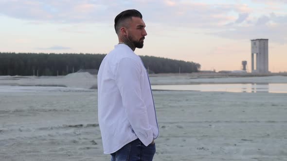 Brutal Man Walking on Beach