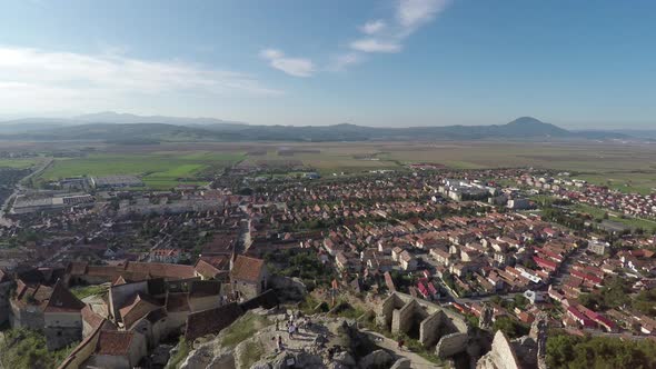 Aerial shot of Rasnov town and fortress alt