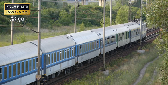 Passenger Train Passes Through the Countryside