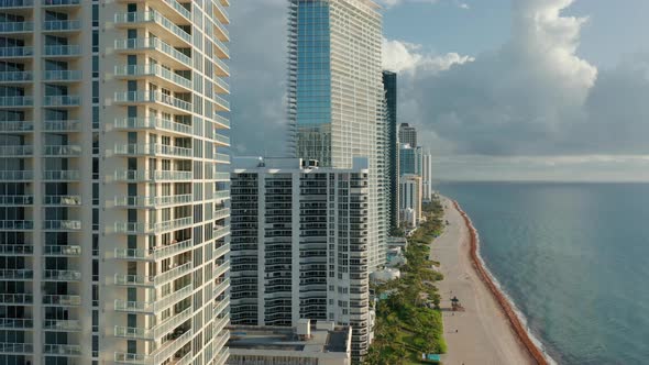 Close Up Aerial View on the Modern Residential Apartment Buildings at the Ocean alt