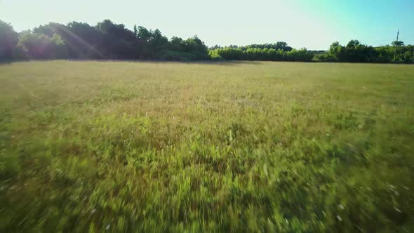 Aerial Video of the Lake on a Warm Summer Day in Light of the Setting Sun alt