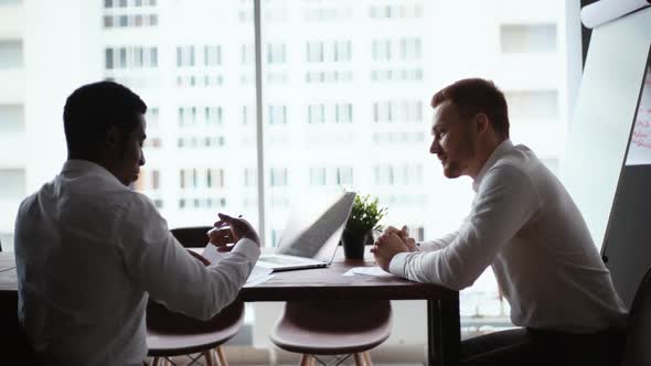African American Business Man Studying Paper Document and Signing Contract Background of Window. alt