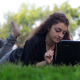 Girl Using Notebook on The Grass 2 - VideoHive Item for Sale