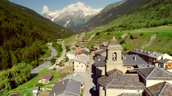 Aerial view of Lanslebourg village and snow peak mountain, Savoie, France. alt