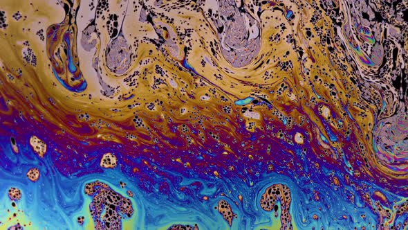 Macro soap bubble creates a colorful and psychedelic background alt