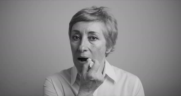 Adult Women. She Paints Her Lips with Lipstick alt