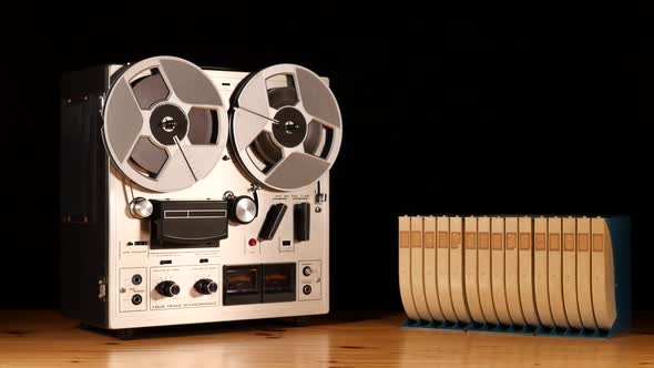 Taperecorder playing music isolated on black background and space for copy alt