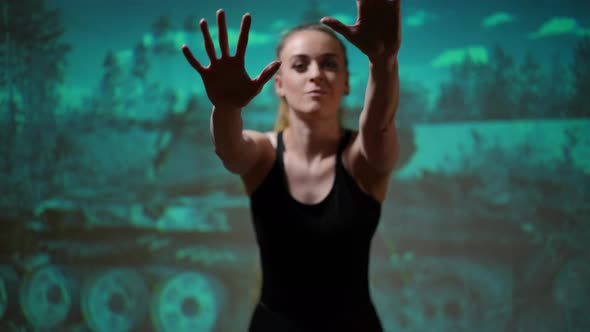 Hands of Blurred Woman Imitating Touching Glass Posing at Background of Bombed House Ruins alt