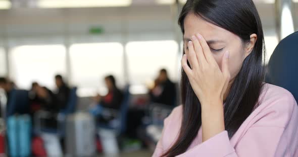 Woman feeling headache on ferry
