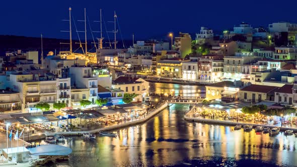 The Lake Voulismeni and Agios Nikolaos Town at Night on the Island Crete, Greece alt