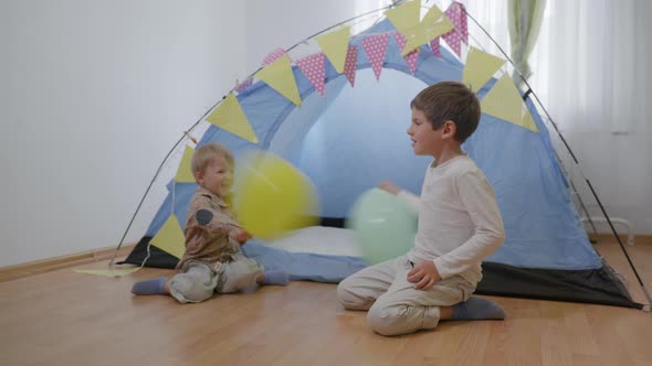 Family Leisure, Beautiful Healthy Brothers Have Fun Playing Balloons alt