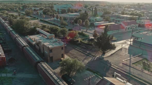 Aerial Of A Freight Train Passing Through Mexican northern Countryside alt