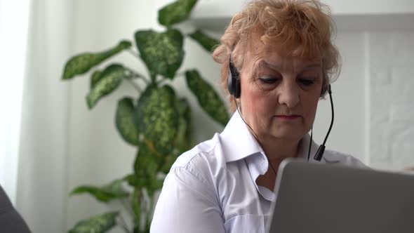 Head Shot Close Up Happy Beautiful Older Senior Woman in Eyeglasses Looking at Camera Showing alt