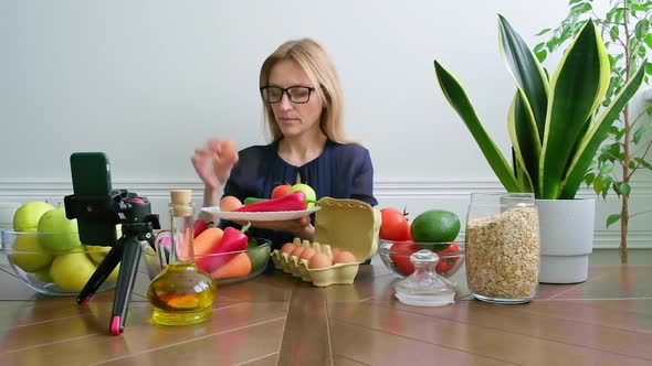 Woman Nutritionist Talking About Healthy Eating Recording Video Stream on Smartphone alt