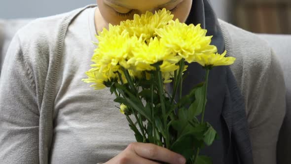 Happy Cancer Survivor Smelling Flowers, Feels Better After Chemotherapy, Hope alt