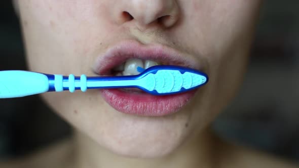 Woman is Brushing Teeth