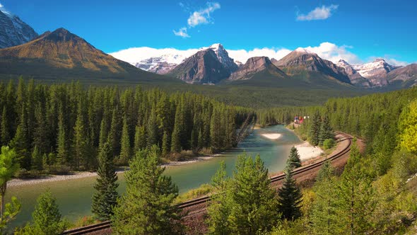 Train Passing Through Morant's Curve in Bow Valley Canada alt