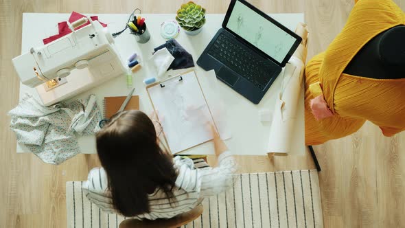 Zoomin Time Lapse of Clothes Designer Using Sewing Machine and Measuring Handmade Garment on Dummy alt