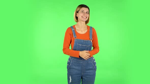 Young Cheerful Woman Showing Thumbs Up, Gesture Like. Green Screen alt