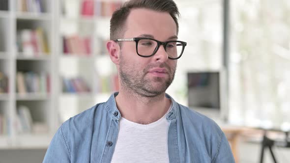 Portrait of Man Sleeping at Work alt