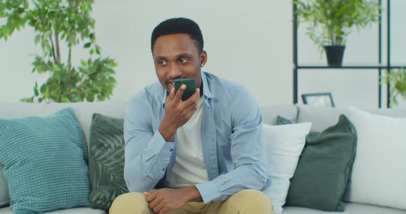 African Man User Speak to Virtual Digital Voice Recognition Assistant Make Request alt