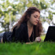 Girl Using Notebook on The Grass - VideoHive Item for Sale
