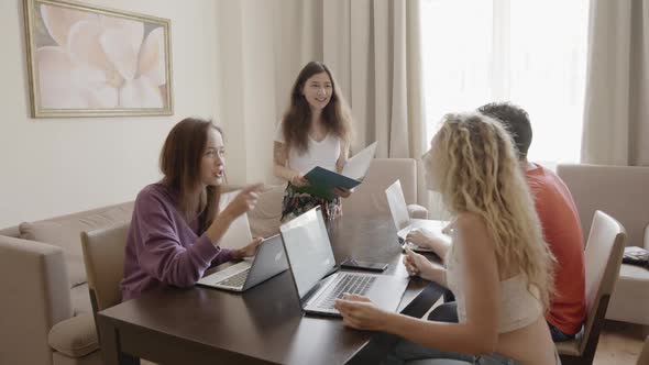 Motivated Young Asian Female Team Leader Brainstorm and Create Ideas Together with Diverse alt