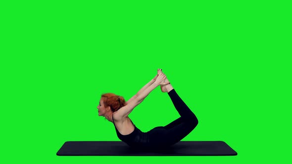 Sporty Fit Woman Stretching During Yoga Exercises On Green Screen