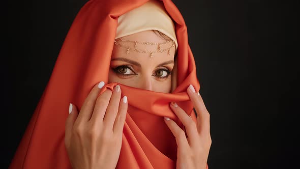 Close Up Portrait Of Beauty Young Muslim Woman In Hijab Looking At Camera.