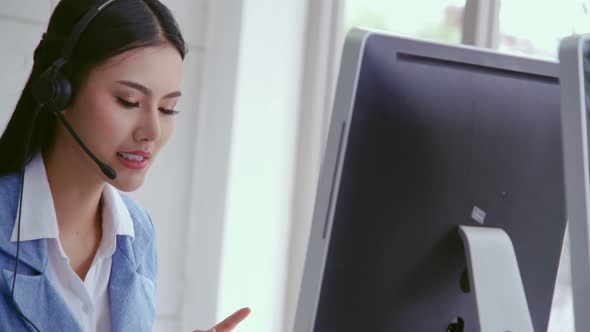 Customer Support Agent or Call Center with Headset Talking to Customer on Phone alt