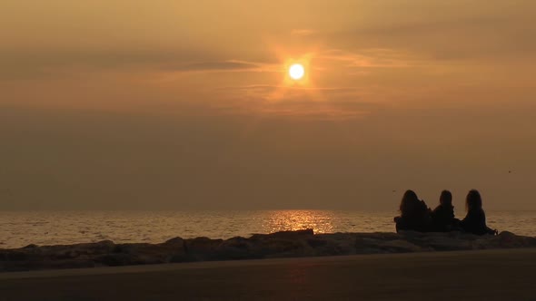 Silhouette Of People Woman Posing At Yellow Sunset alt