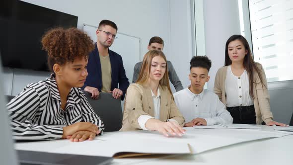 Architects Discussing Masterplan at Meeting in Office alt