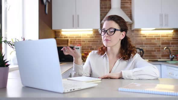 Businesswoman Communicating By Video Call alt