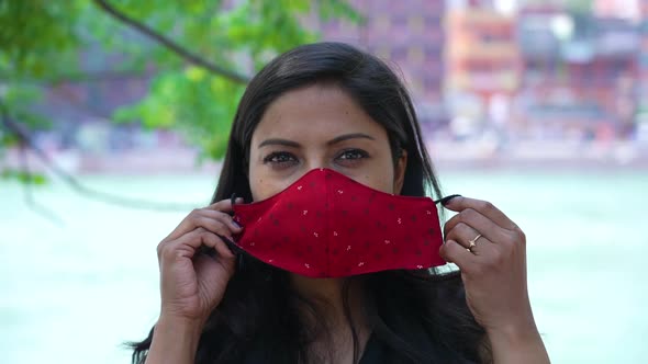 Indian Woman Wearing Coronavirus Protection Face Mask Holy River Ganges Flowing in Background