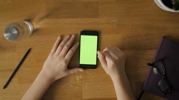 Girl Hands Using Mobile Phone With Green Screen