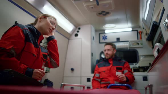 Health Care Professionals Going for Emergency Call in Ambulance Car alt