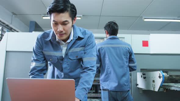 engineer team control and operate printing package lable machine with computer screen alt