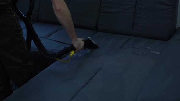 Cleaning Sofa With Vacuum Cleaner
