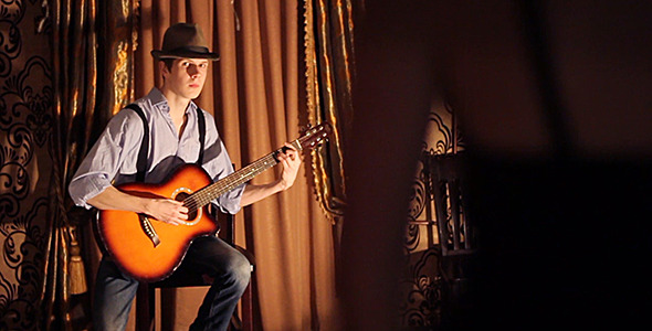 Man Playing Guitar for Woman