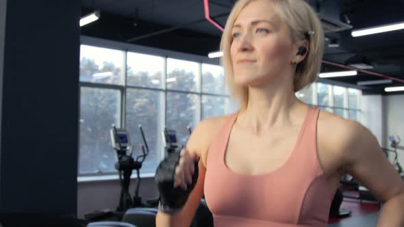 Young woman training on treadmill