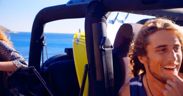 Group of Friends Interacting Each Other in The Beach 4k alt