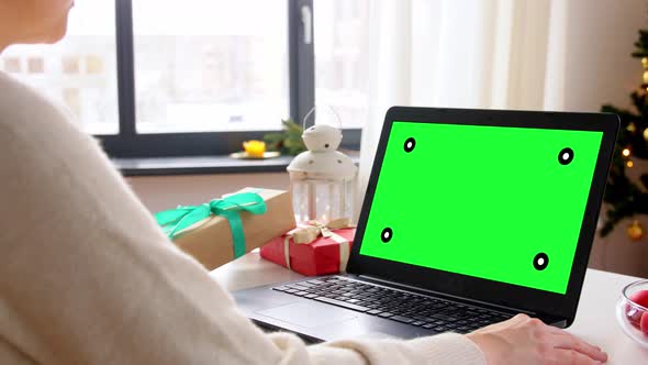 Woman with Laptop Having Virtual Christmas Party alt