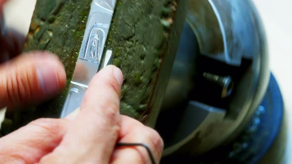Hands of craftswoman working in workshop alt