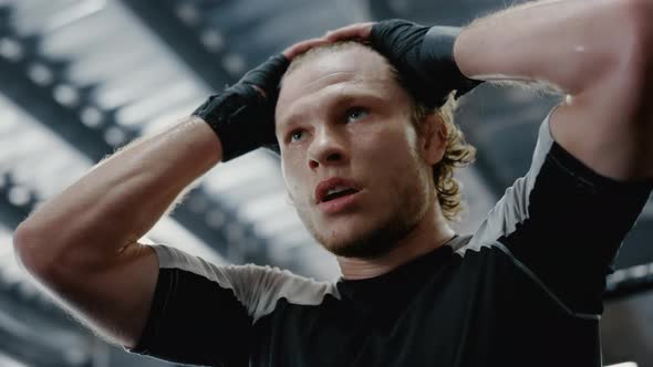 Sexy Sportsman Touching Hair in Sport Club. Fighter Thinking About Fight at Gym alt