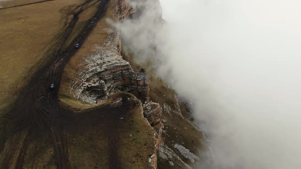 Aerial View of Stone Amphitheater in Thick Clouds Bermamyt Plateau Caucasus