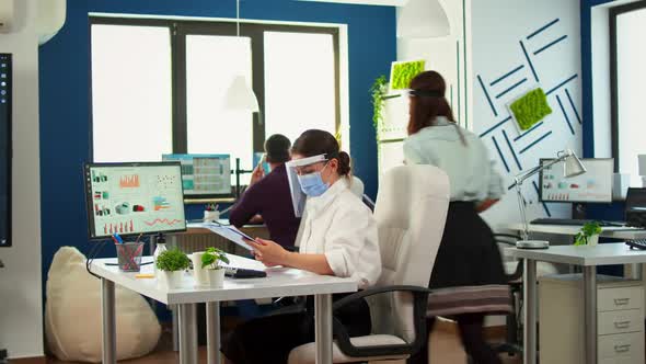 Teamworkers in New Normal Office Making Financial Strategy alt