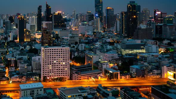 Time Lapse Night Cityscape and Highrise Buildings in Metropolis City Center alt
