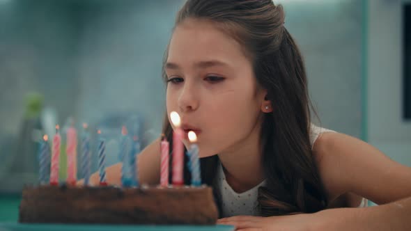 Portrait of Girl Blowing Candles in Slow Motion, Stock Footage | VideoHive
