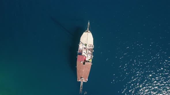 Aerial Top Down Rotating Drone Shot of a Motor Yacht in Mediterranean Sea